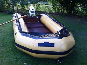 Inflatable, hard floor dingy with outboard engine and oars