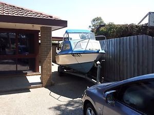 1980's 5 metre Fibreglass Half Cabin with damaged 1981 Johson 90HP V4 Outboard