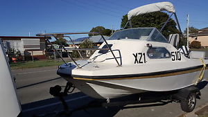 fiberglass half cabin boat , 70hp johnson,runs well.. 15 ft