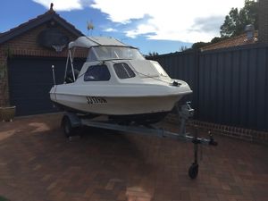 5m Fibreglass half-cabin boat, with 40hp motor and trailer