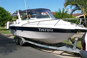 millenuim 2400 weekender boat and trailer