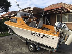 Boat yellow /white fibre glass swiftcraft , Sea Ranger ½ cabin
