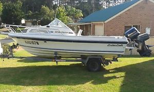 5 metre Cruisecraft fibreglass boat with 80 hp Evinrude outboard motor