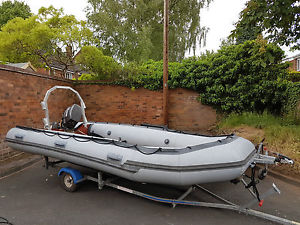 5 Mt inflatable boat 30 HP outboard and trailer