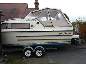 Shetland Saxon cabin cruiser, Mariner 25hp and trailer