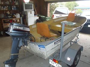 3.6 m Savage Tinnie, 15 Hp 2 stroke Yamaha outboard, custom built trailer