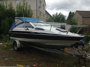 Bayliner 3litre capri with cuddy cabin and camper top.