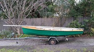 Sail boat, dinghy, National E (Lazy E) sailing boat with road trailer and beach