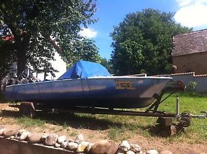 5.1 m long ALUMINUM BOAT POWERED by a 65 HP Mercury MOTOR, with VOLVO gearbox