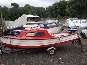 14 ft Cabin boat with trailer and 25 hp evinrude and a 3.9 archemedis