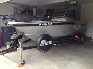 Tracker Targa V-175 full windshield, 115 HP Mercury Optimax motor.