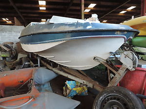 Fletcher Boat and Trailer, Rubber dingy type boat and an outboard engine.