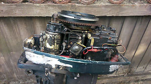 Evinrude 30 HP with a tank and line    remote gear change and throttle control
