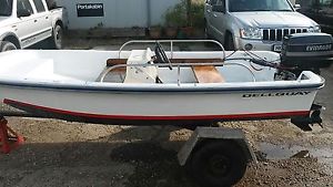 Dell Quay Dory boat with 30 hp Evinrude outboard engine on trailer