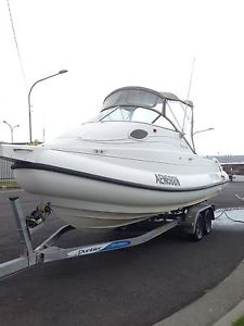 Fibre glass cruise sports boat. suzuki 140 outboard.