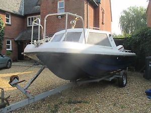 Fishing Boat, 17 ft Wilson Flyer with Johnson 70 outboard, on good road trailer