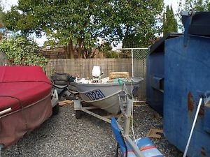 tinnie 11ft  6hp johnoson and trailer