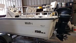 2005 Carolina Skiff with 1992 Mercury 75hp and 2005 Magic Tilt trailer