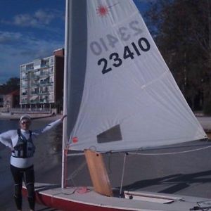 Older Laser Sailing Boat on Registered Trailer
