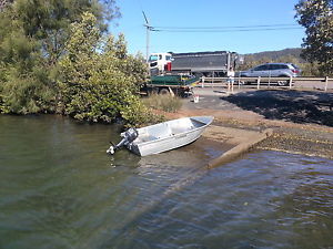 Aluminium Ally craft car topper plus outboard motor and trailer. Great boat.