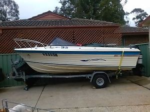 Sportscraft 5mtr fibreglass boat with 90 hp evinrude motor.