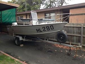 4.3 mtr Savage tinny, centre console, 35 hp Johnson, on trailer.