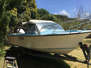 A Cruisecraft 5.2 metre boat with as new 120 HP outboard motor