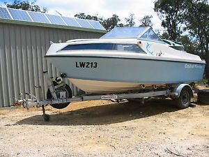 5.3 mt HALF CAB BOAT with Dunbier trailer, both registered.
