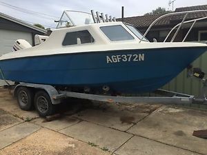 18ft Stejcraft, half cabin with 150hp Evinrude