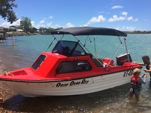 Fibreglass boat, half cabin, 70HP Johnson, many extras, new trailer
