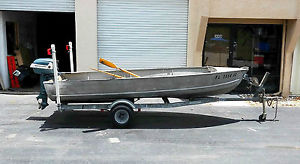 1958 aluminum Feather Craft Lark w/orig motor(rebuilt),and trailer!............