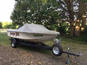Stingray ski boat with gal trailer and 115hp Mariner S/S Prop an custom cover