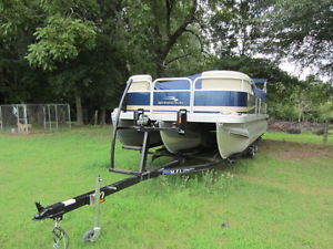 Bennington 24 SLI tritoon boat ready for water pontoon boat