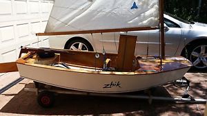 Sabot wooden vintage sailing dinghy, boat yacht, including beach trolley.