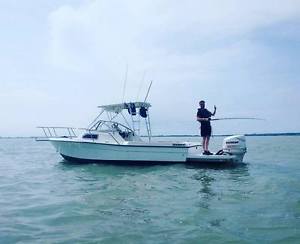 24ft SPORTS FISHING AND WAKEBOARDING CUDDY BOAT AND TRAILER VERY FAST