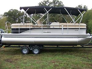 LOWE SS230 WT TRI-TOON POWERED BY A MERCURY 150 4S AND TRAILER-HUGE DEALS